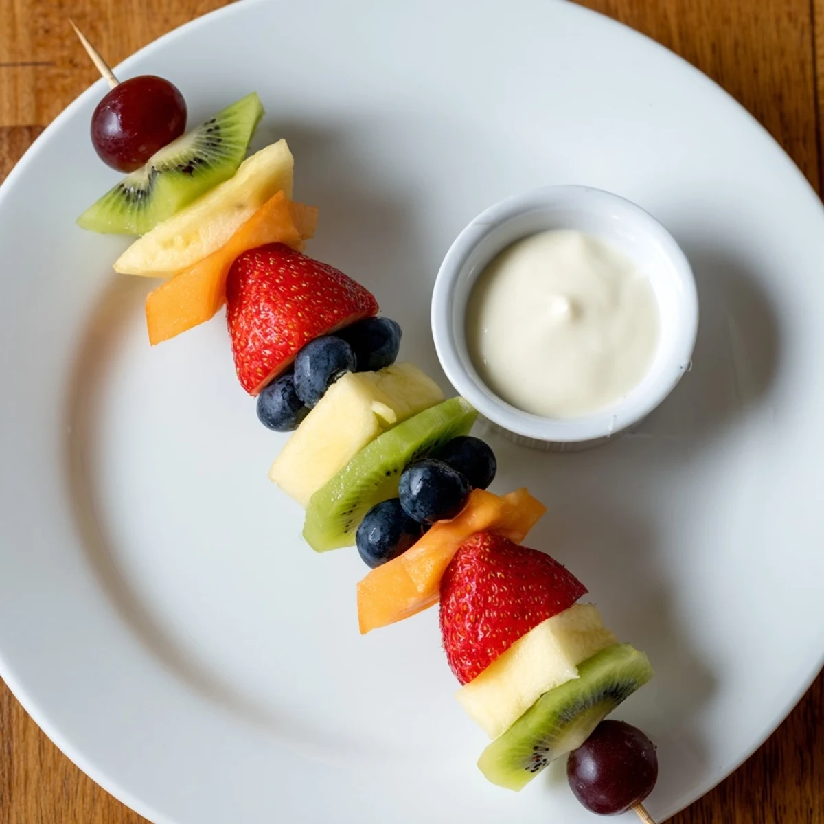 Sweetheart Fruit Kabobs with Yogurt Dip feature heart-shaped melon and kiwi on skewers, perfect for a festive and healthy dessert.