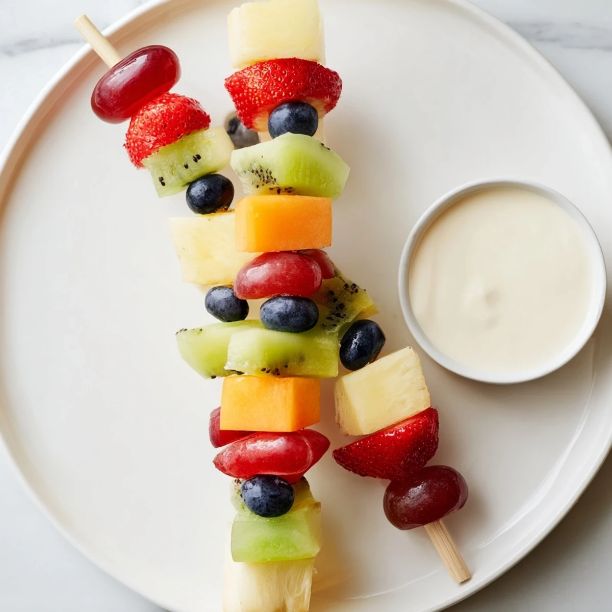 Colorful Sweetheart Fruit Kabobs with Yogurt Dip are ready to serve, ideal for Valentine’s Day parties or a sweet snack.