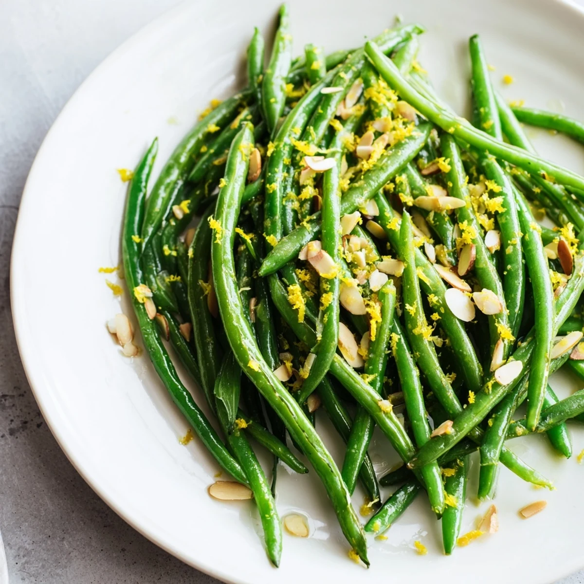 Green Beans with Toasted Almonds and Lemon featuring bright green beans and golden toasted almonds.