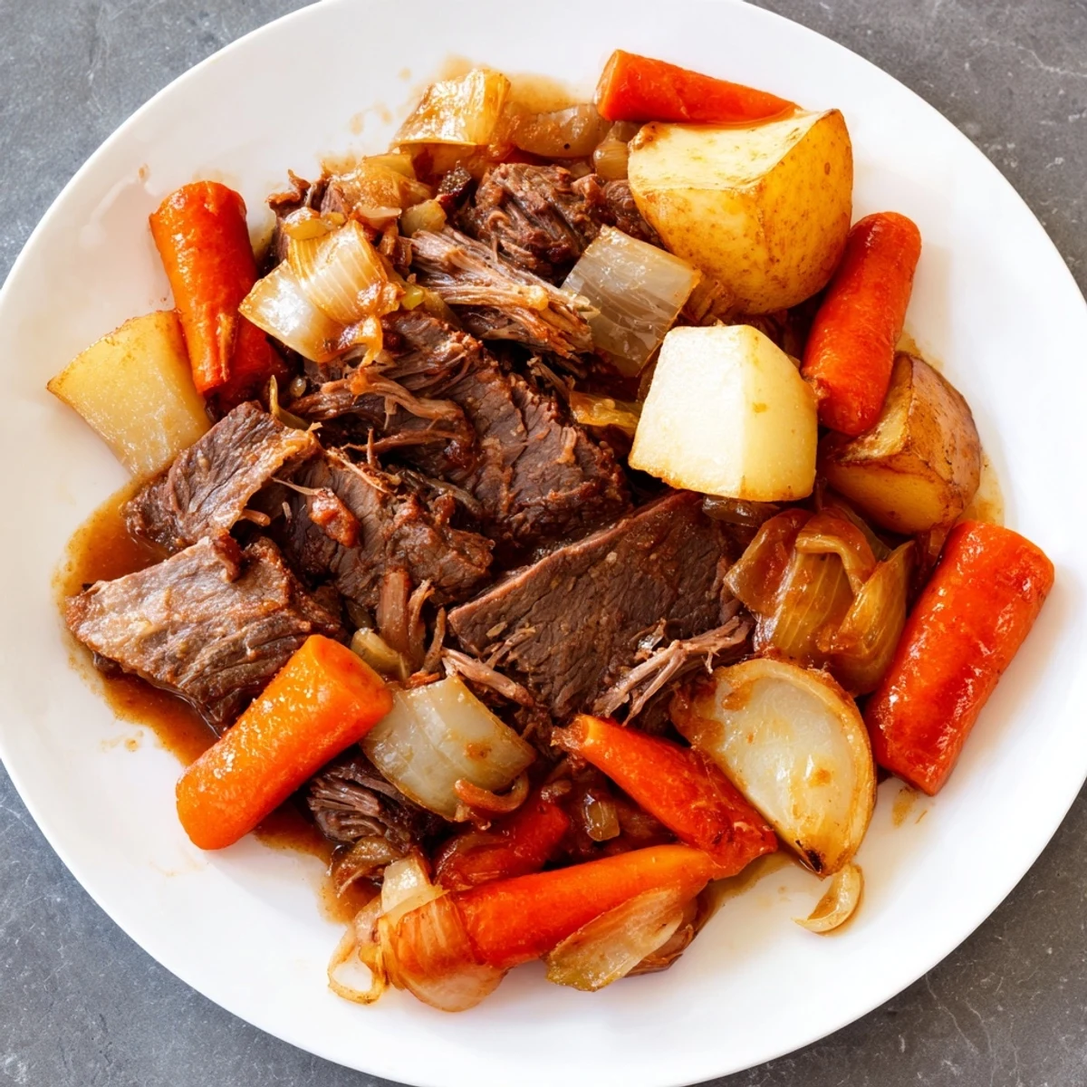 A plate of Slow Cooker Beef Pot Roast with Root Vegetables and carrots beside a glass of red wine.  