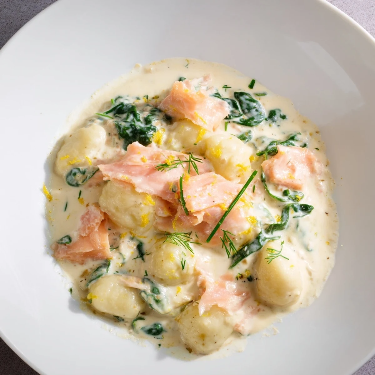 Steaming Healthy Smoked Salmon Gnocchi glistens in a skillet, creamy sauce coating the pillowy pasta.