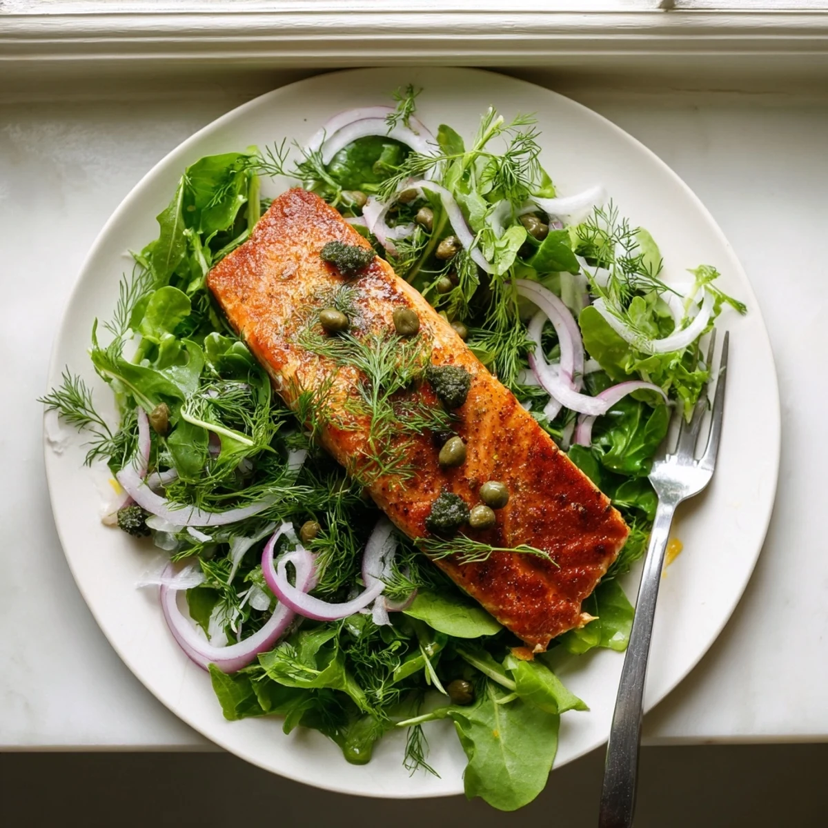 A close-up shows perfectly cooked Crispy Skin Tasmanian Atlantic Salmon with flaky flesh and crunchy texture.  