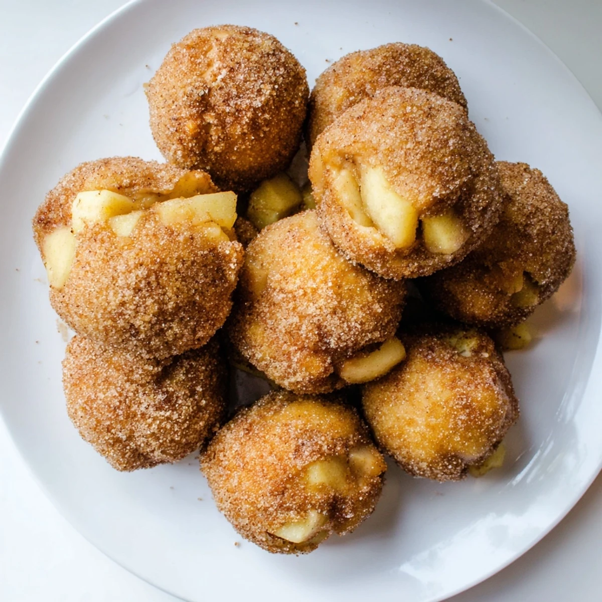 Warm apple pie bombs oozing with melted caramel and tender spiced fruit filling