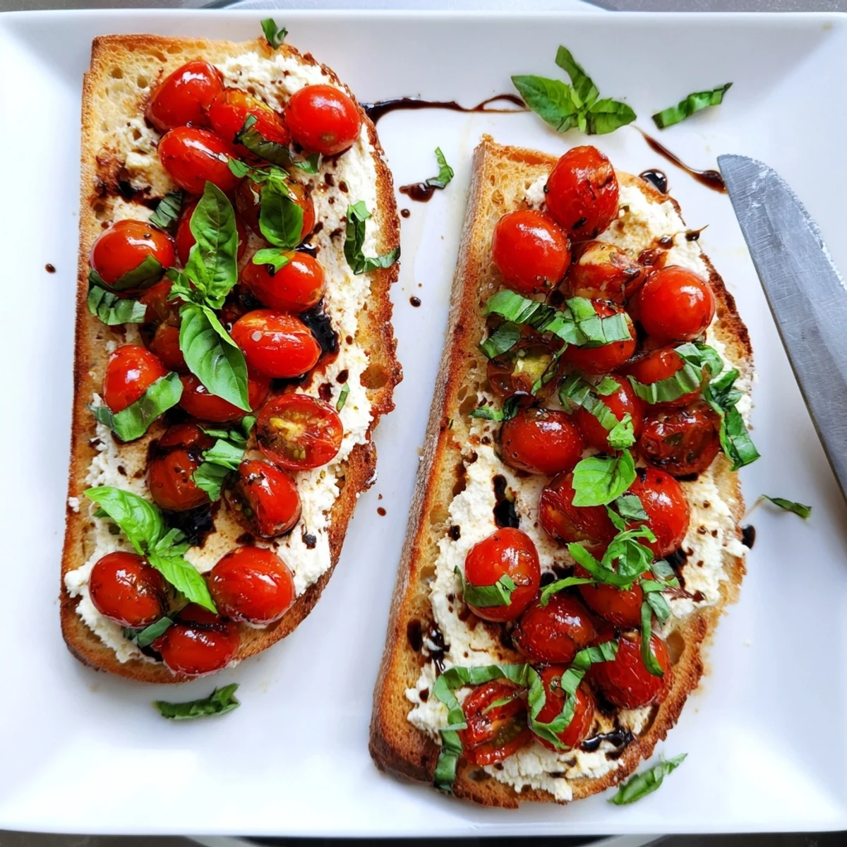 Crispy sourdough slice spread with creamy ricotta and vibrant tomatoes for Mediterranean breakfast