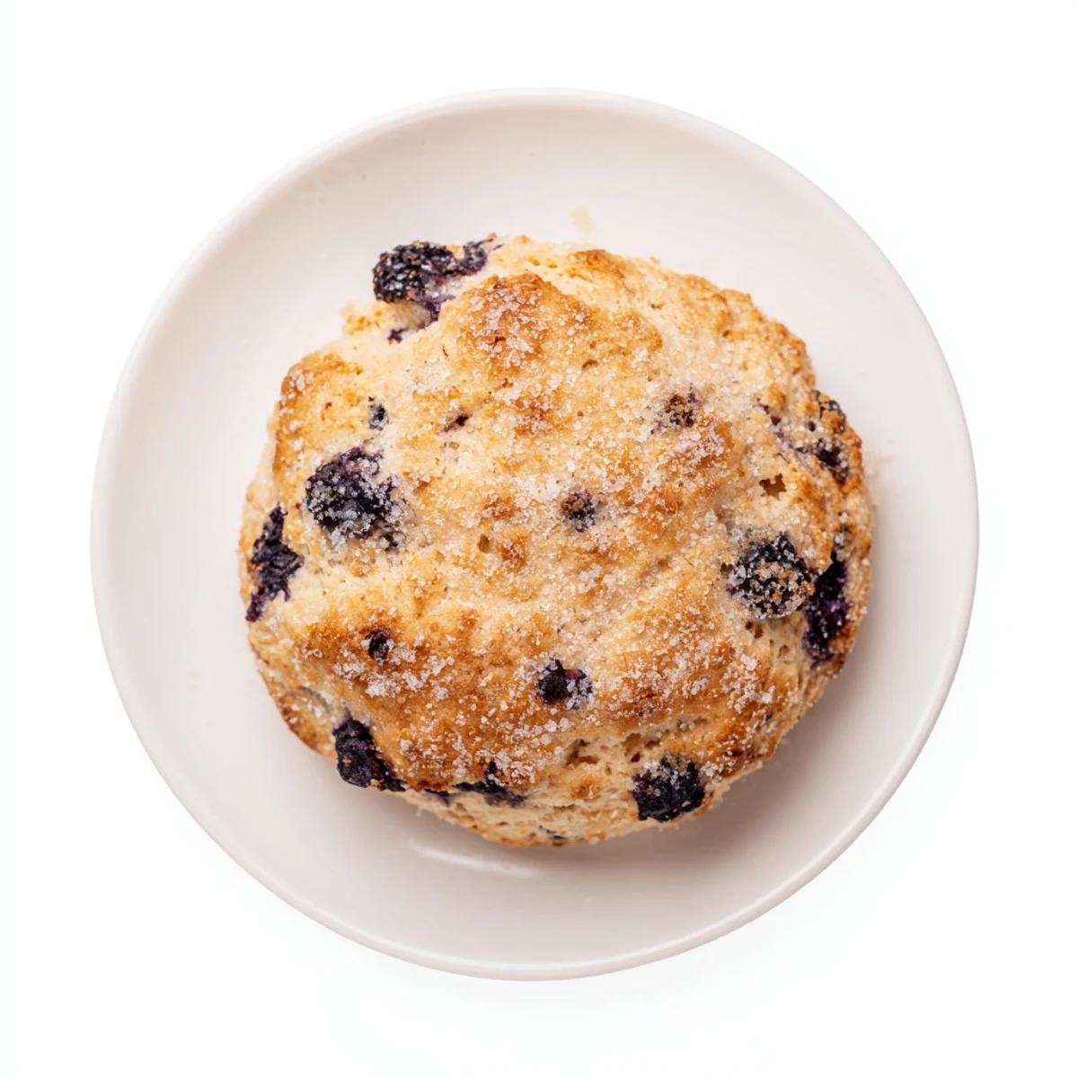 Flaky breakfast pastry topped with cream and plump berries dusted with aromatic Vietnamese cinnamon