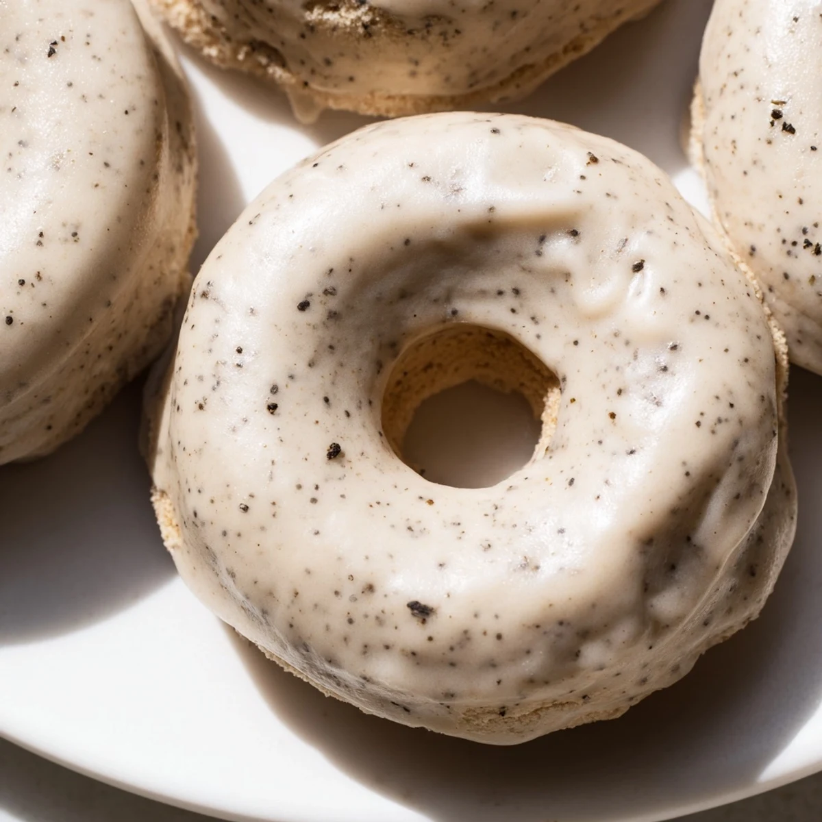 Stack of fluffy mochi donuts with fragrant Bergamot flavor and glossy vanilla coating