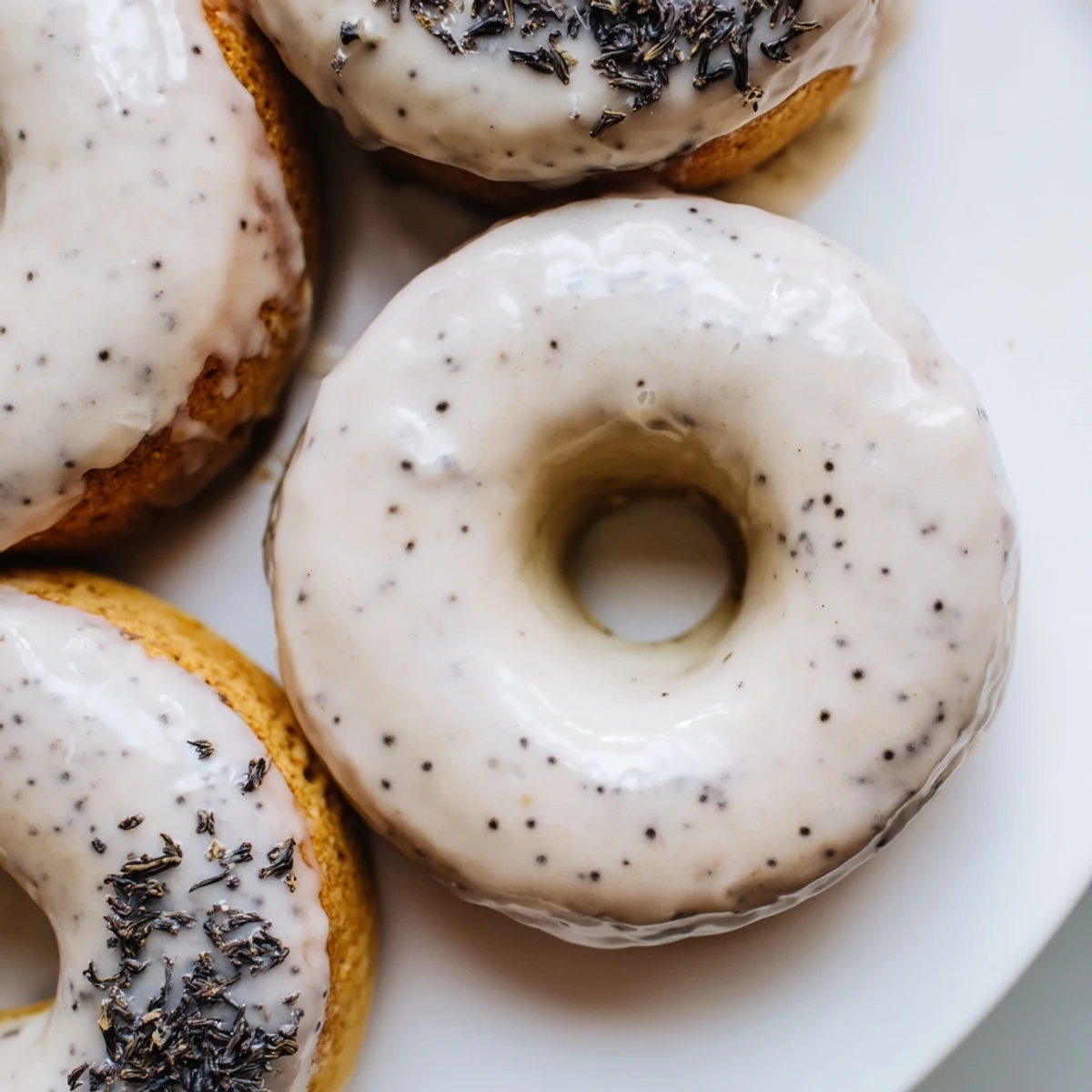 Chewy tea-infused donuts drizzled with Earl Grey glaze, sprinkled with aromatic tea leaves