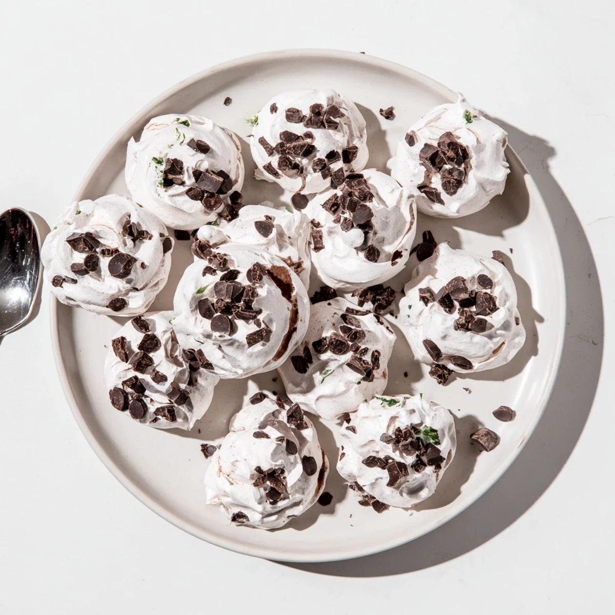 Fluffy dark chocolate mint chip meringue clouds ready for holiday dessert platter