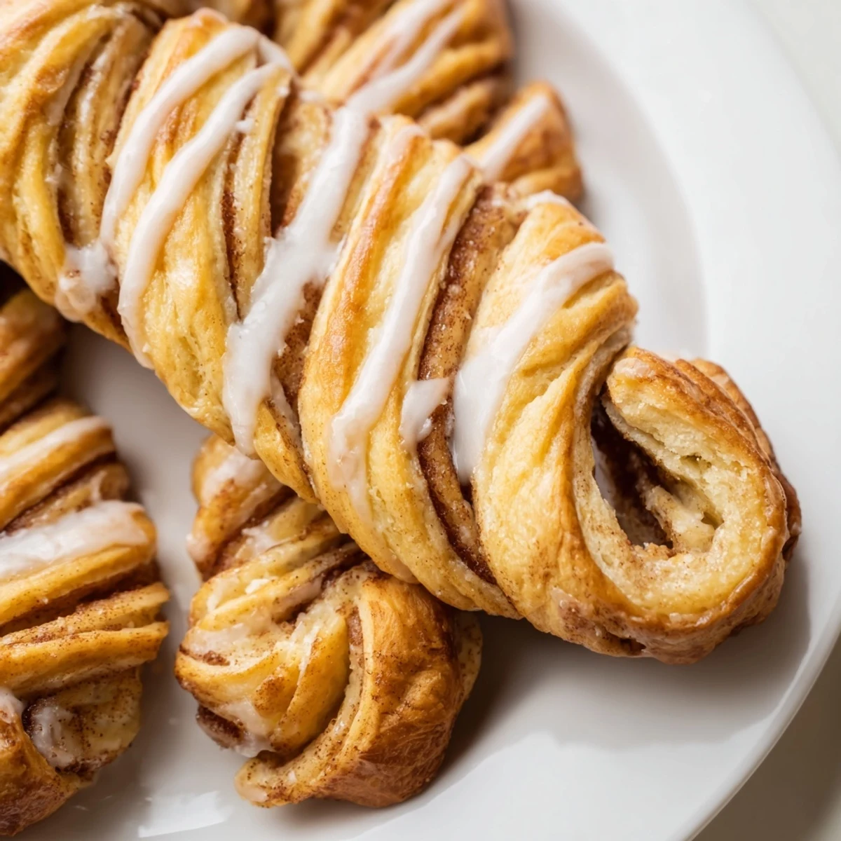 Soft baked pastry spiraled with cinnamon sugar filling topped with sweet white icing