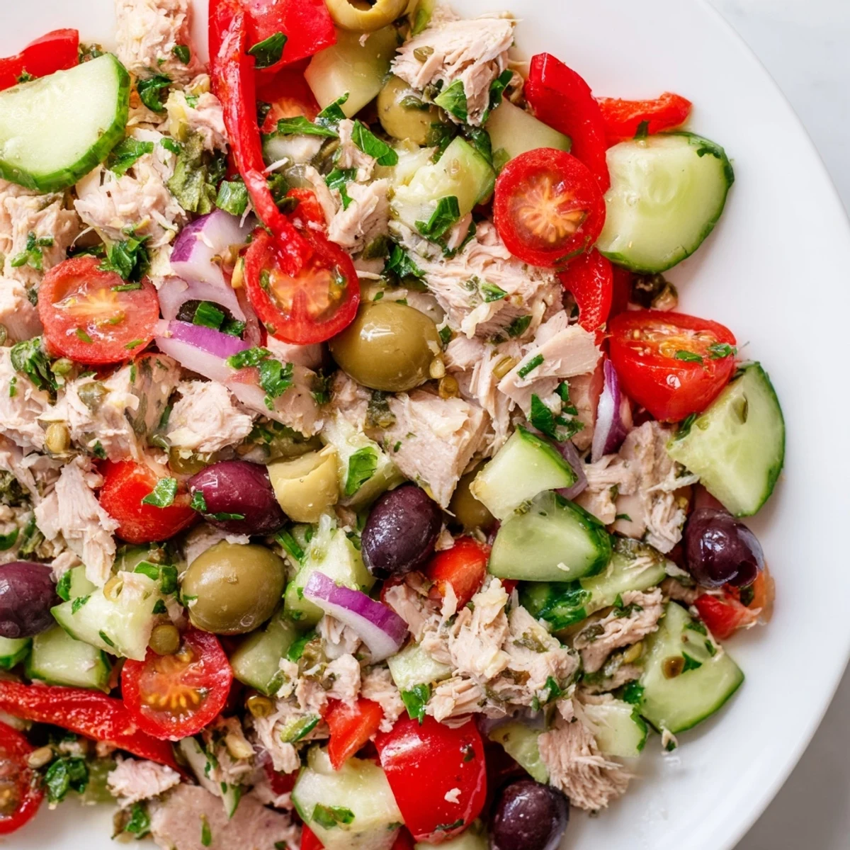 Flaky tuna mixed with crisp cucumber, bright red peppers, and tangy Kalamata olives