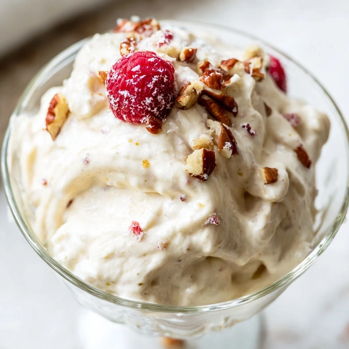 Light and airy keto cheesecake fluff swirled in a white serving dish
