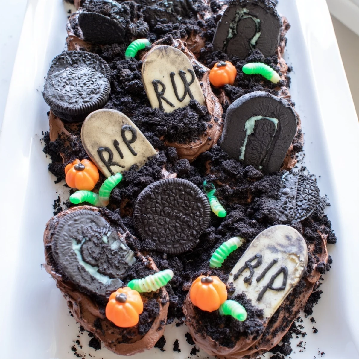 Close-up of Pull Apart Graveyard Cupcakes showing rich chocolate frosting and spooky edible graveyard decorations