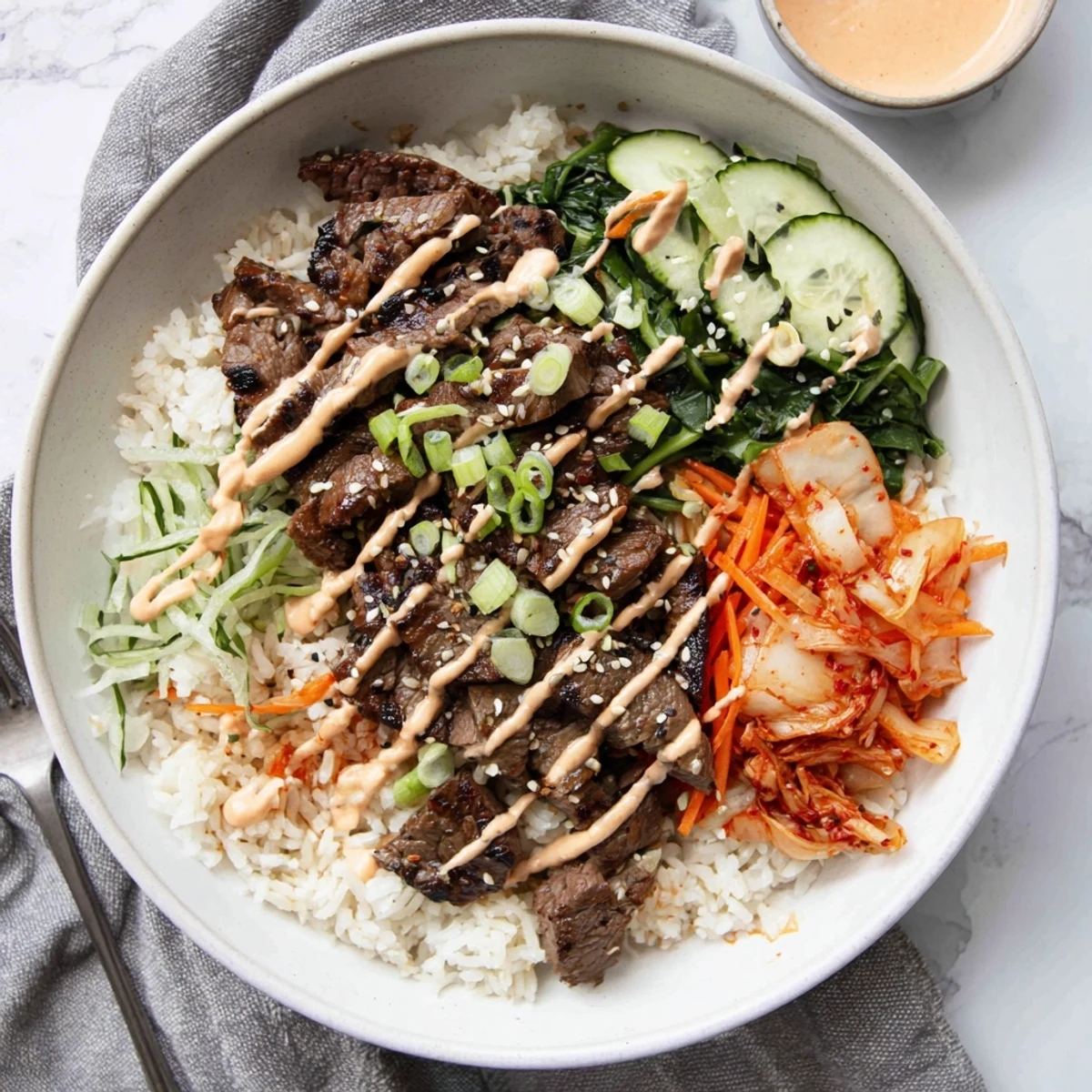 Sizzling caramelized steak over fluffy jasmine rice in Korean BBQ steak rice bowls