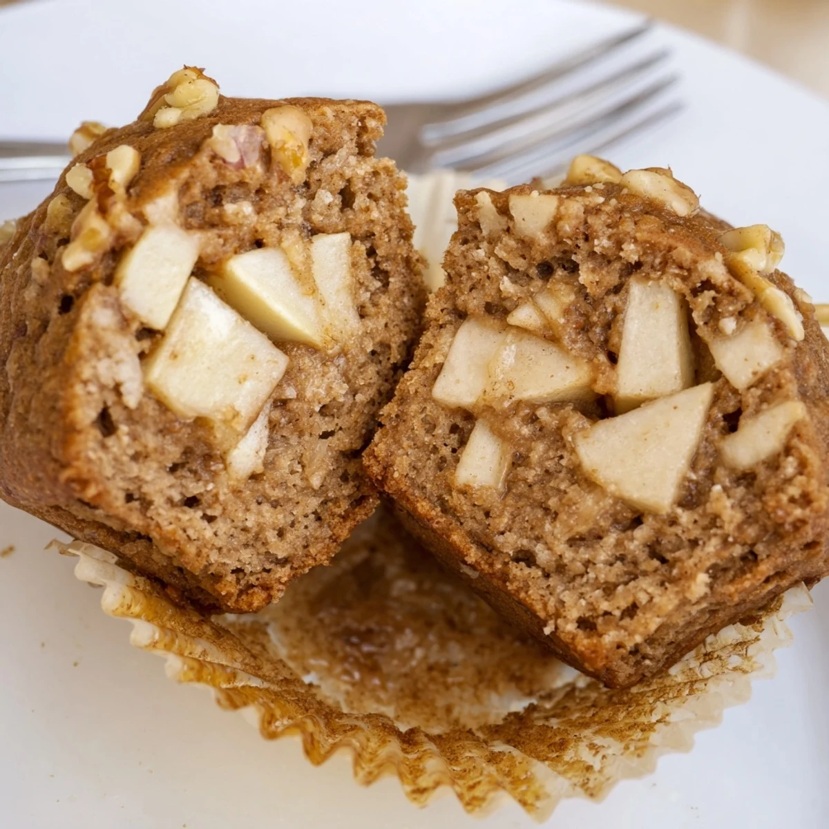 Plate of Healthy Apple Cinnamon Greek Yogurt Muffins with honey drizzle