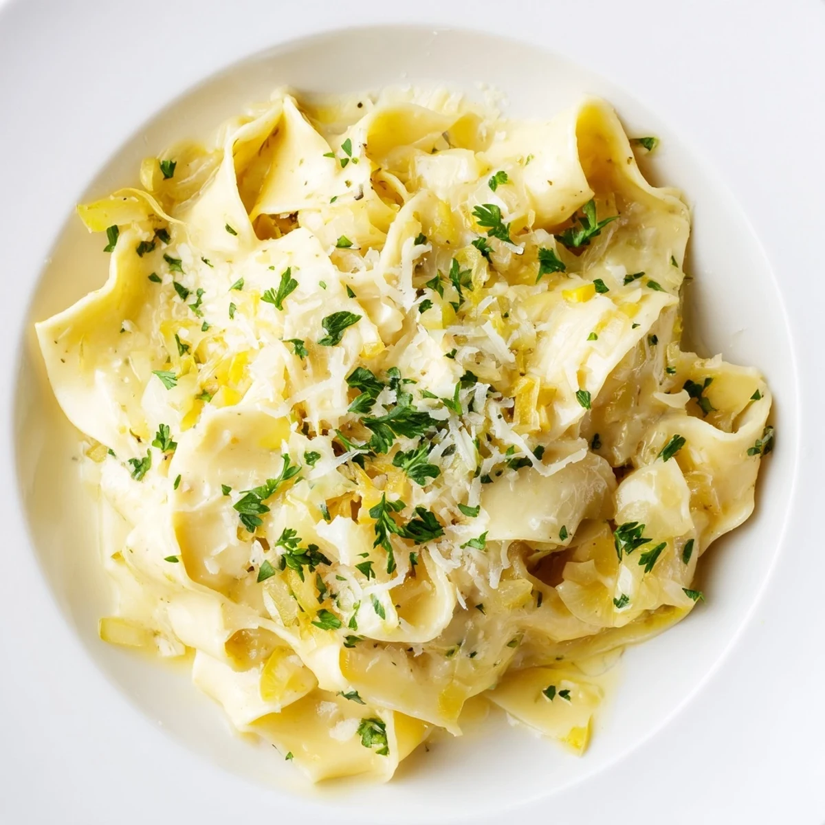 Creamy cafeteria noodles in a white bowl showcasing velvety smooth cheese sauce coating every tender strand