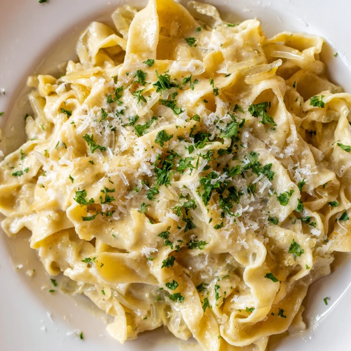 Comforting American noodle dish topped with fresh parsley and extra grated Parmesan cheese for serving
