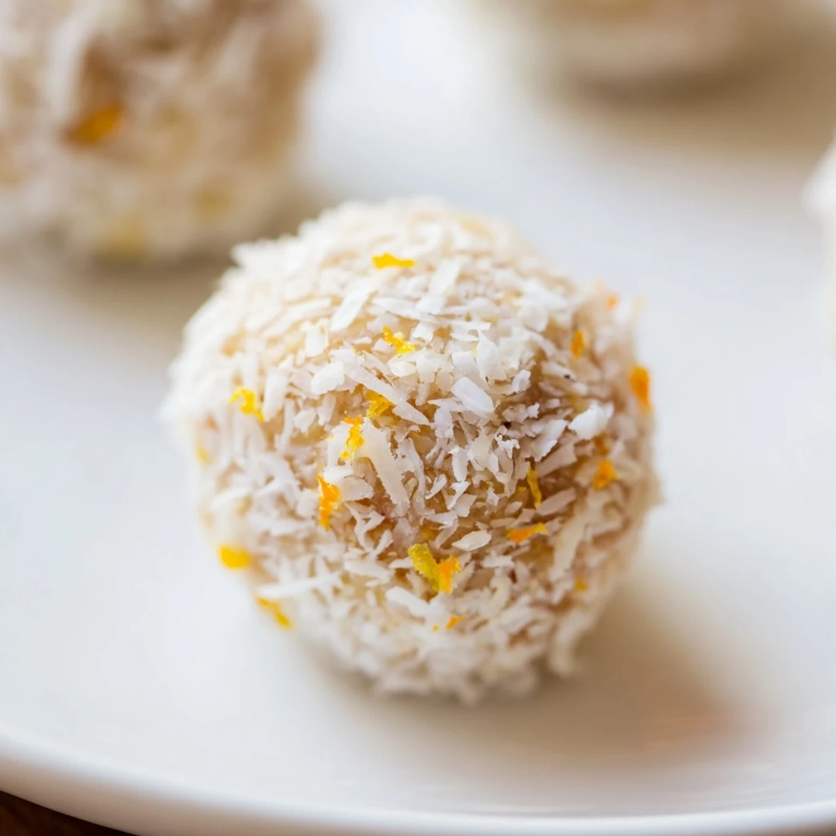Fresh no-bake Citrus Bliss Bites arranged on parchment paper for baby shower