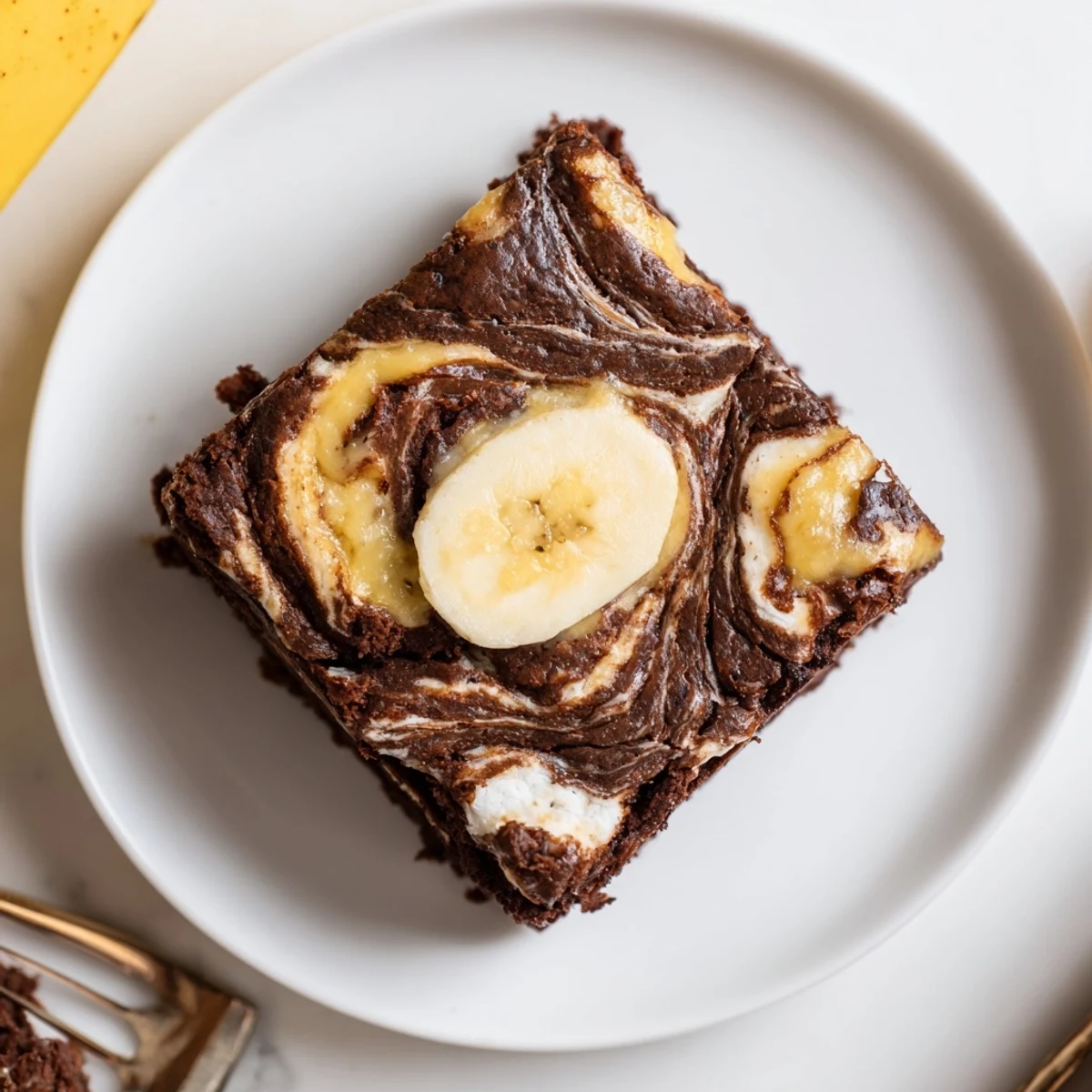 Banana Pudding Brownies with marbled banana swirls and crunchy vanilla wafer topping