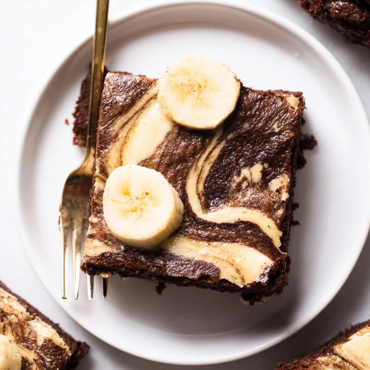 A warm pan of Banana Pudding Brownies releasing rich chocolate aroma, gooey center
